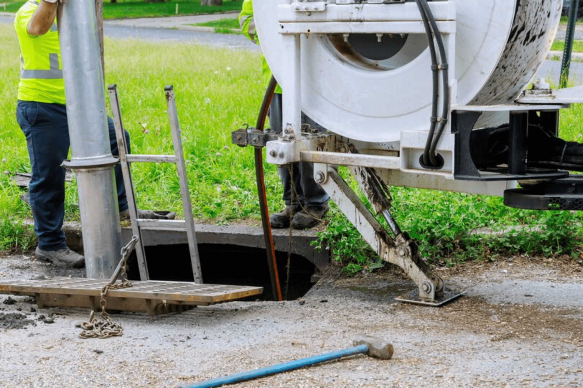 Machine for cleaning sewer wells in the a town street